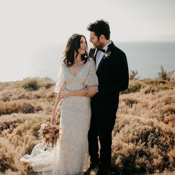 bride and groom posing for their wedding portrait in the desert