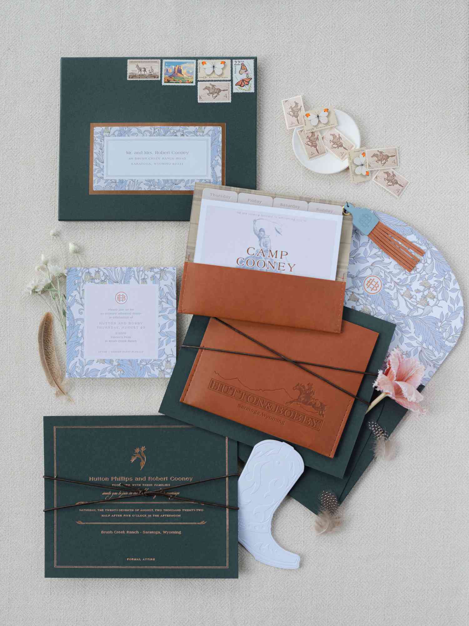western-inspired wedding invitation suite with leather accents and floral pattern
