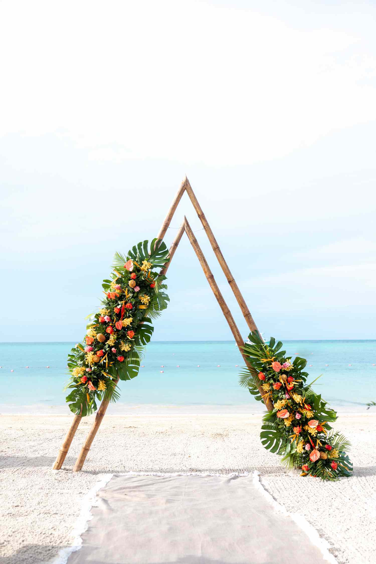 Tropical Colorful Flower Decor on Triangle Arch At Beach Wedding Altar