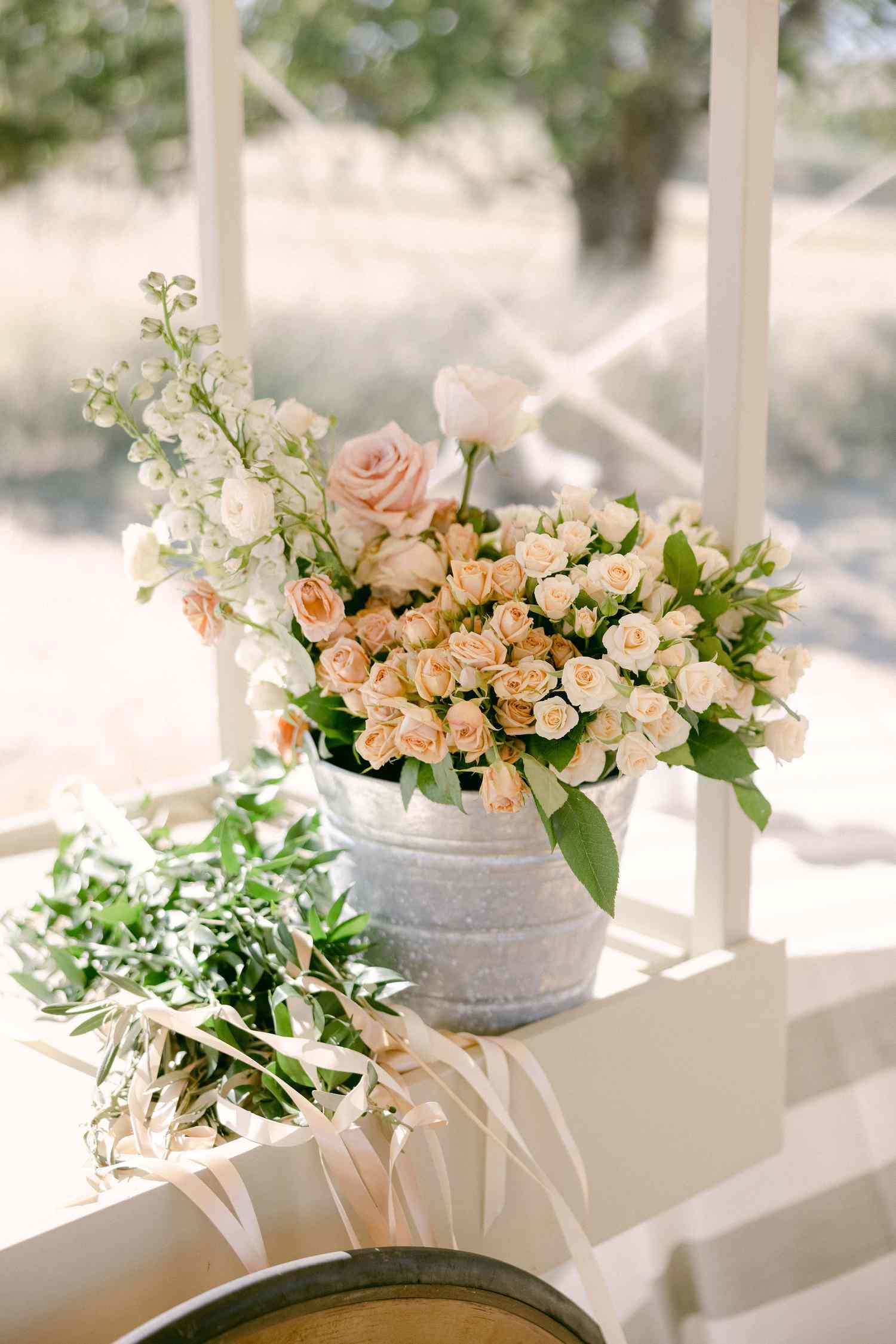 Galvanized Bucket brimming with pastel roses