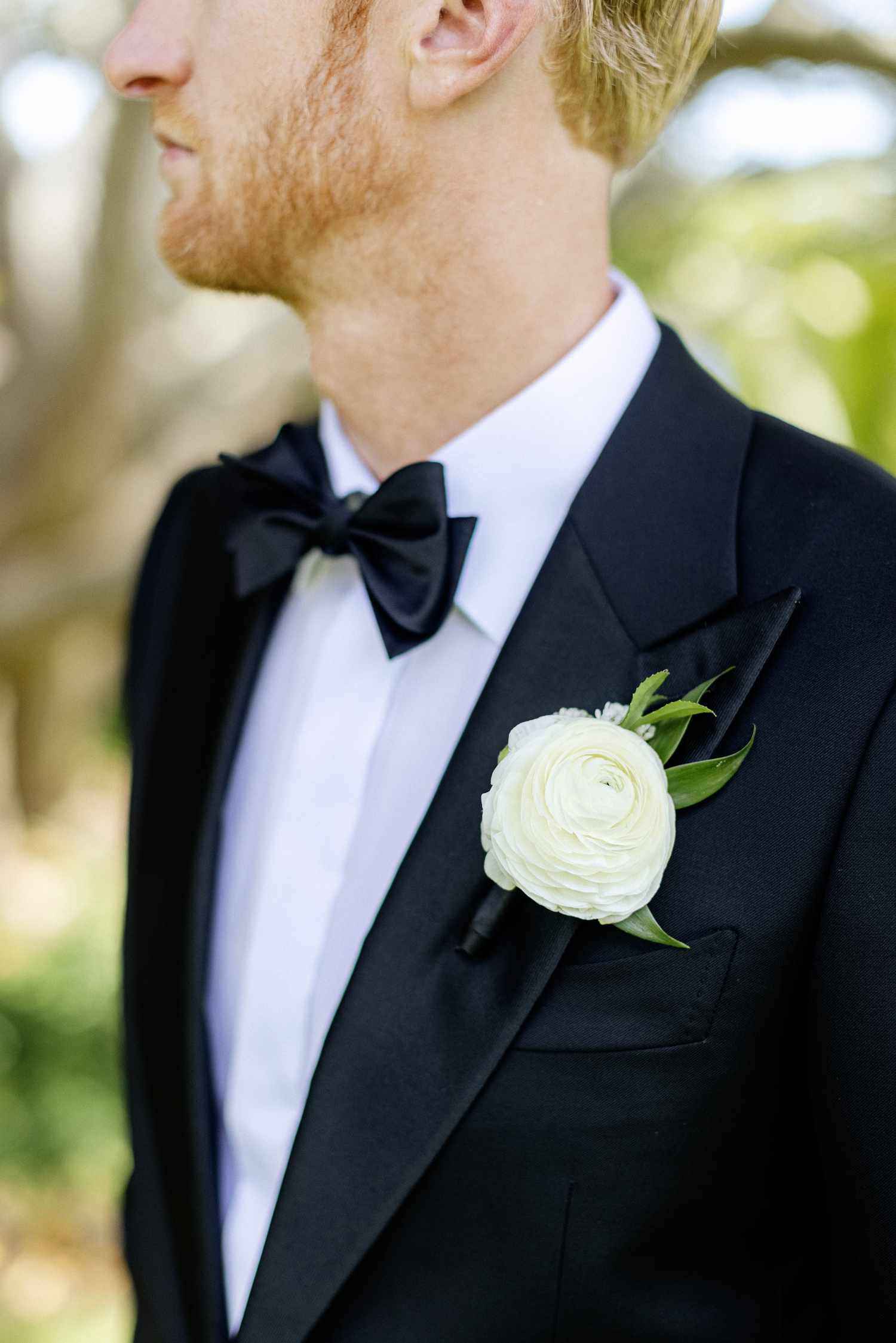 Close Up of Olympic Volley Ball Player Chase Budinger's White Ranunculus Boutinniere