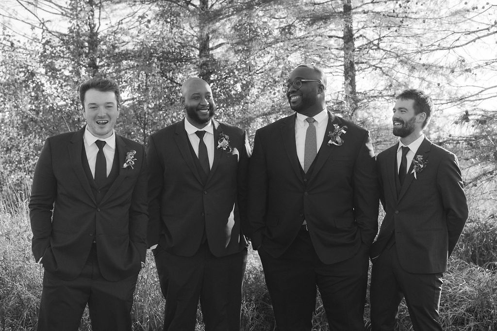 Black and White Portrait of Groom and Groomsmen in Suits