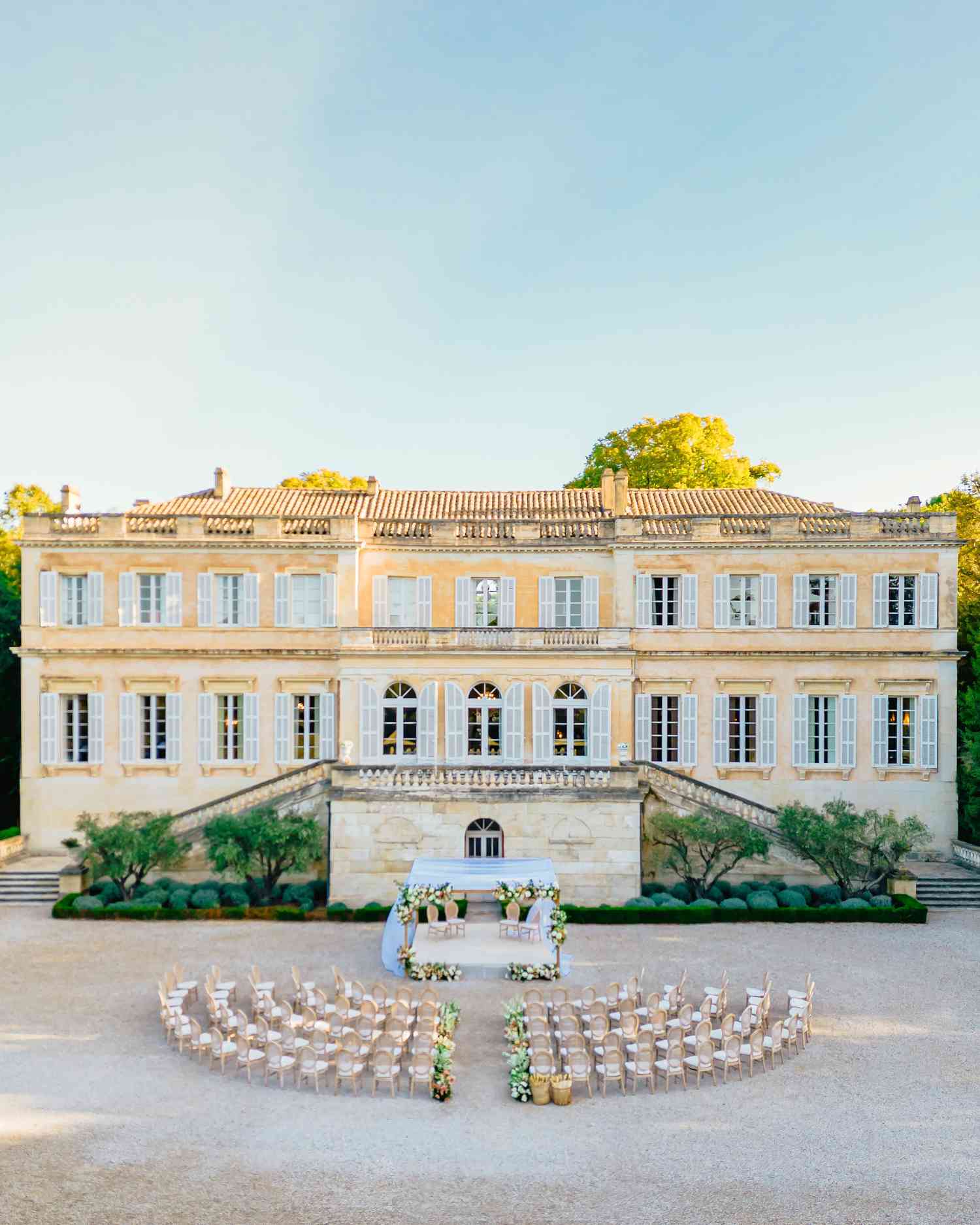 tan mansion with blue sky background