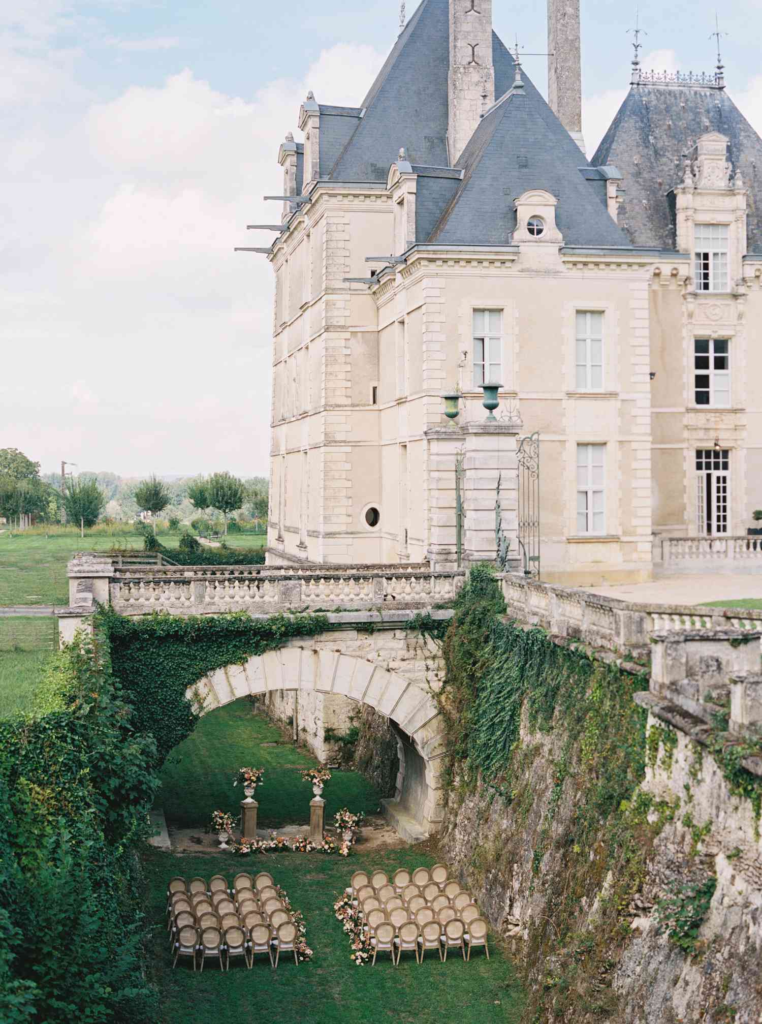 Outdoor Wedding Ceremony Under Bridge of Castle Wedding Venue