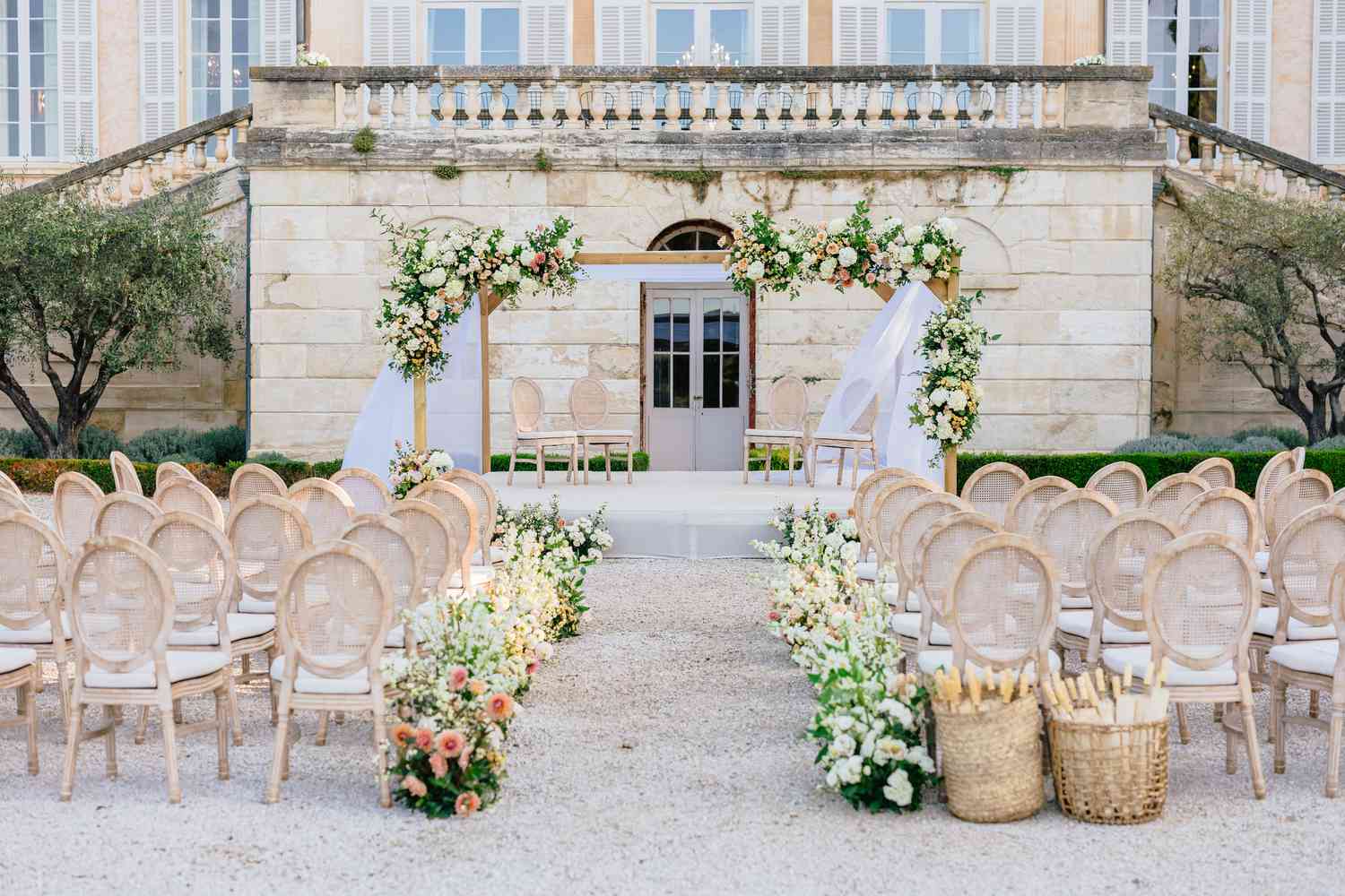 wedding ceremony with flowers and chairs