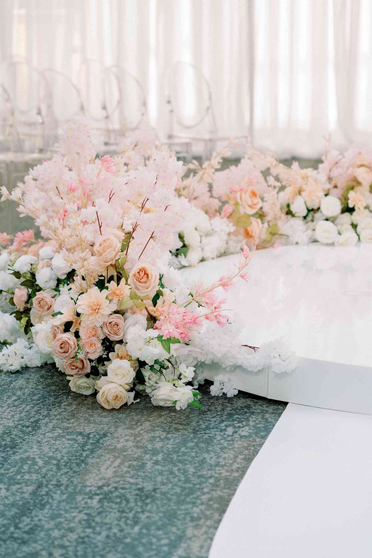 podium with flowers surrounding the bottom