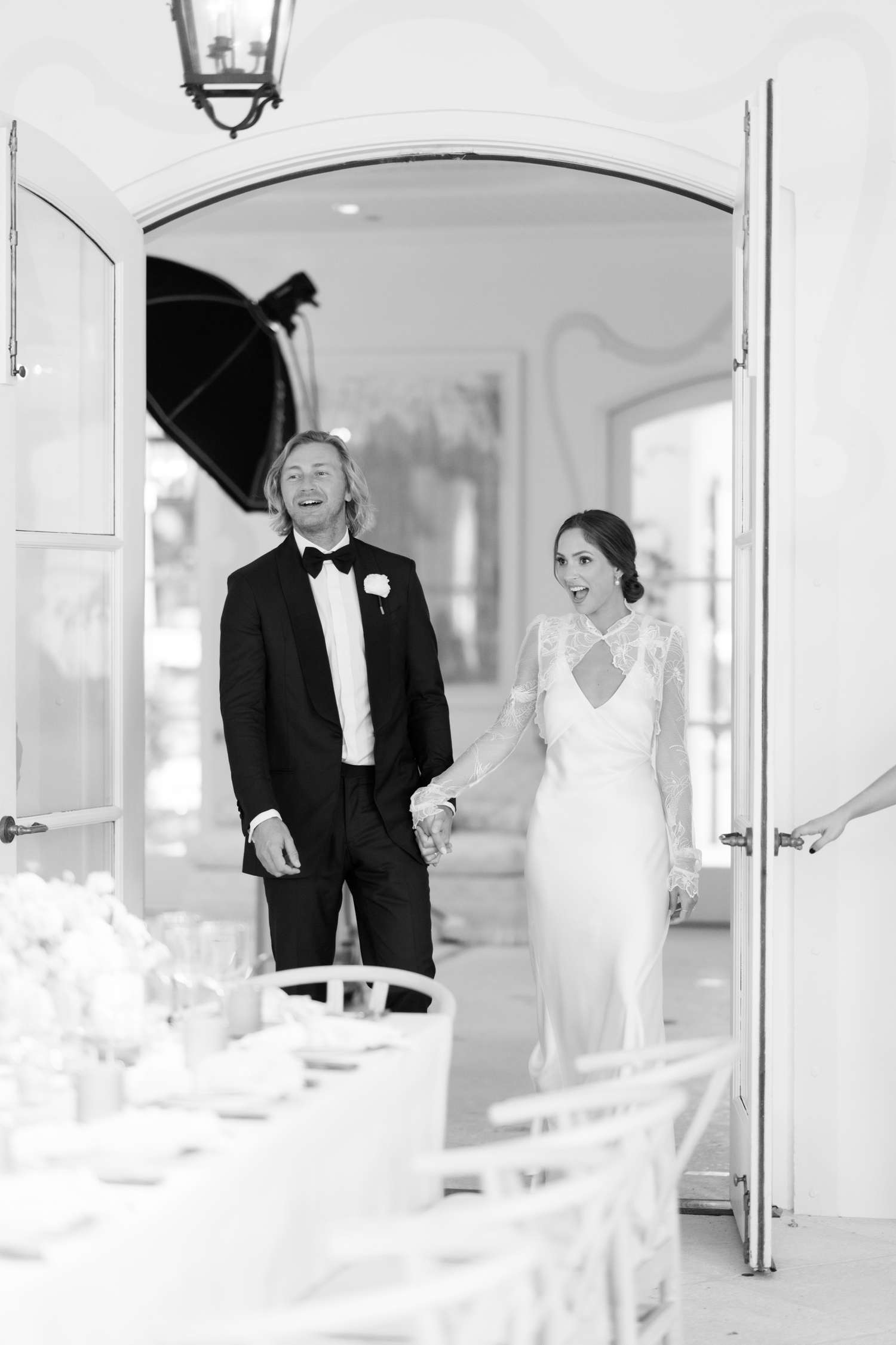 A Bride and Groom's Wedding Entrance Through a Set of French Doors