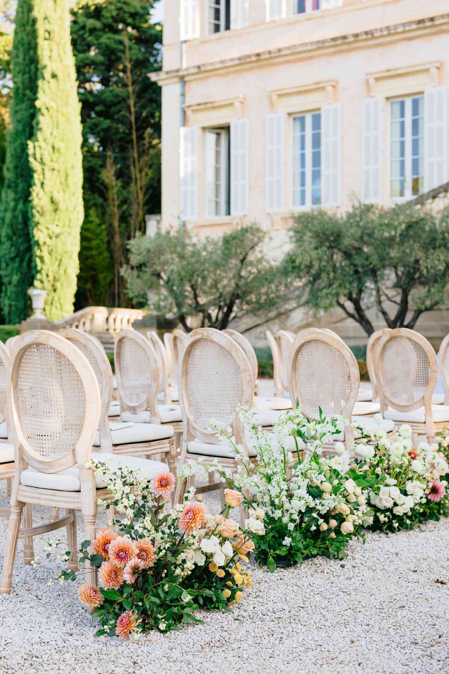 wedding ceremony chair and decor details surrounded by flowers