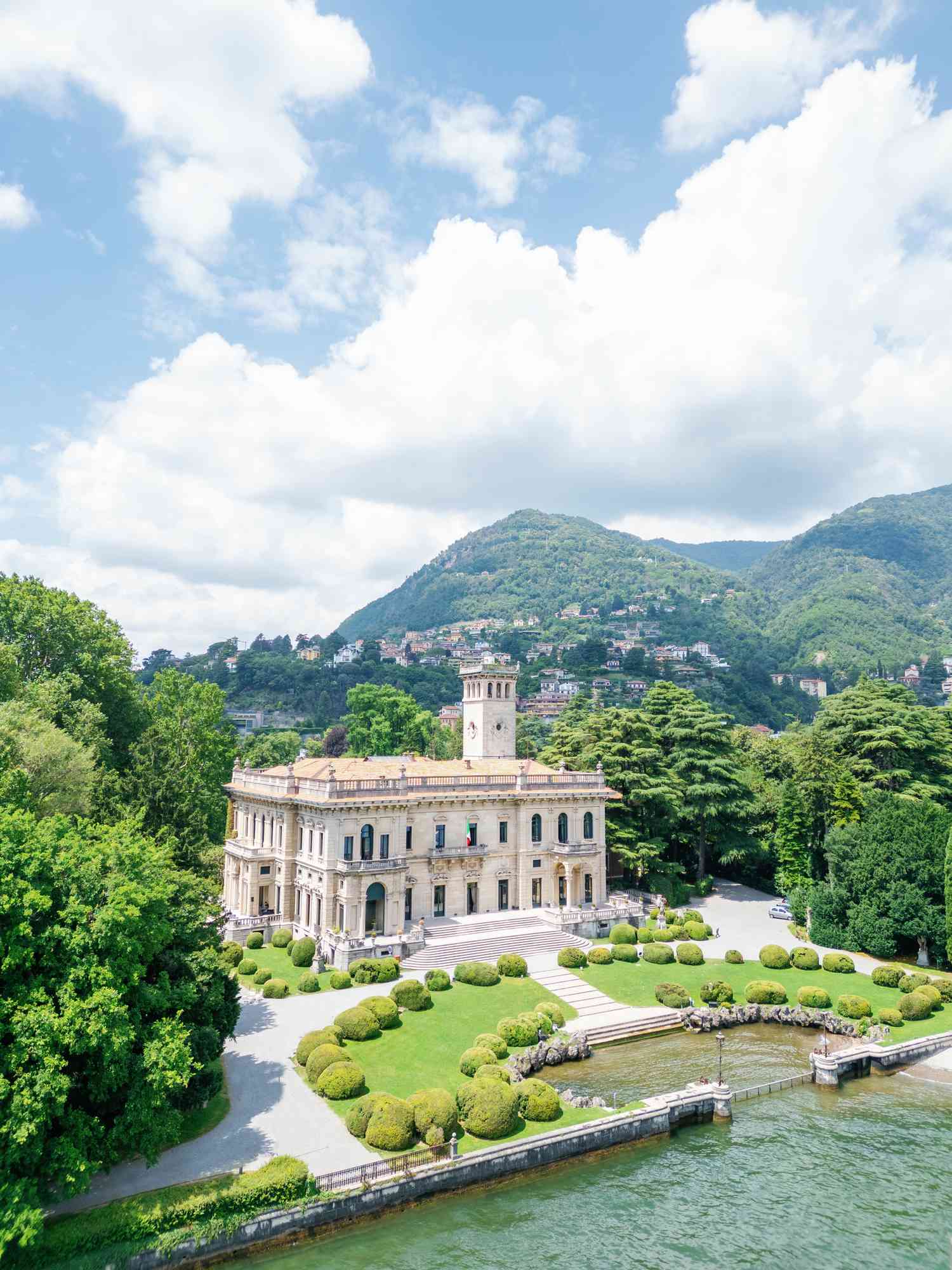 Aerial Shot of Italian Villa Wedding Venue With Bush Garden on Waterfront