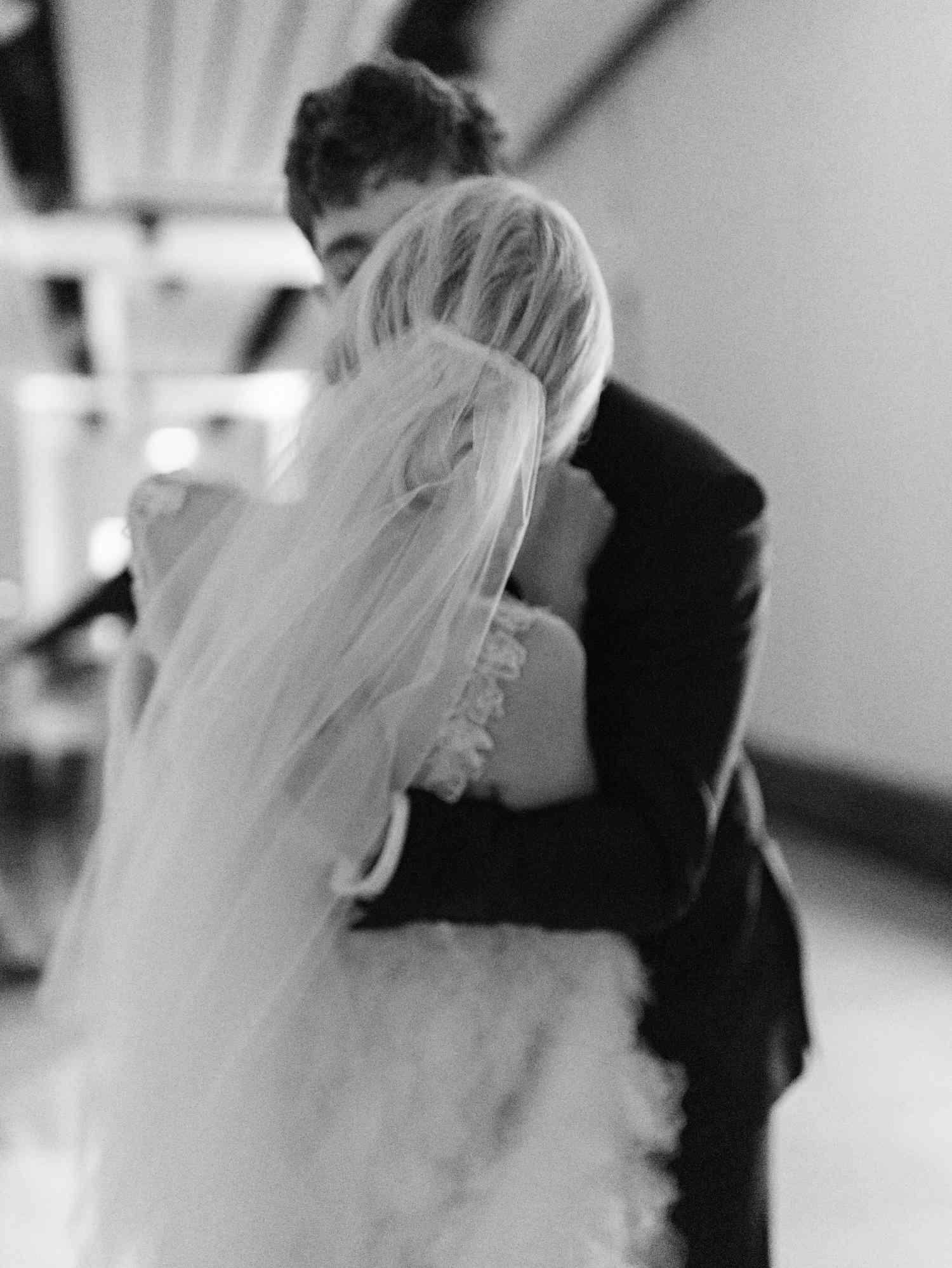 Black and White Portrait of Wedding Couple Kissing