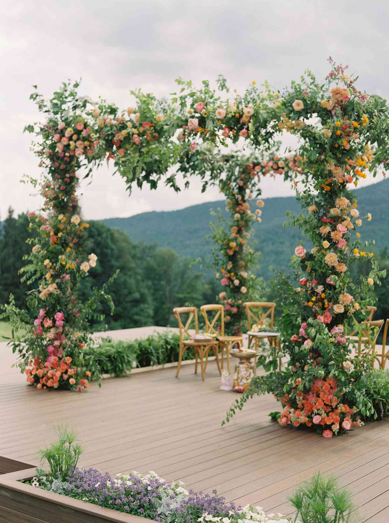 mandap decorated with greenery and roses