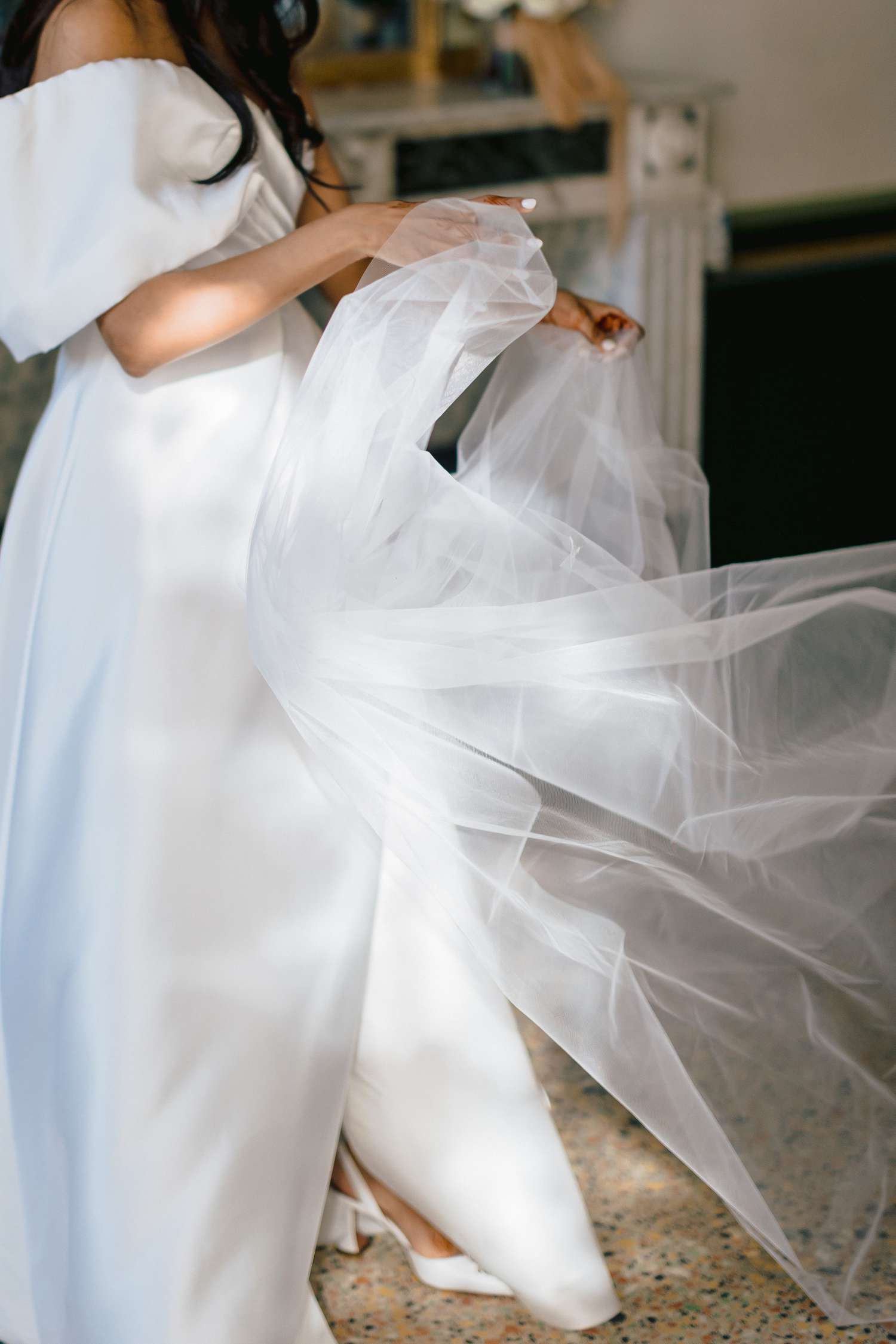bride in white wedding dress and veil