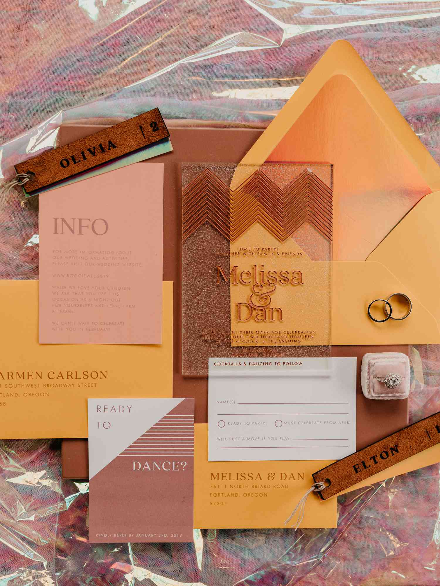 sparkly acrylic invites with orange envelopes and watercolor liner