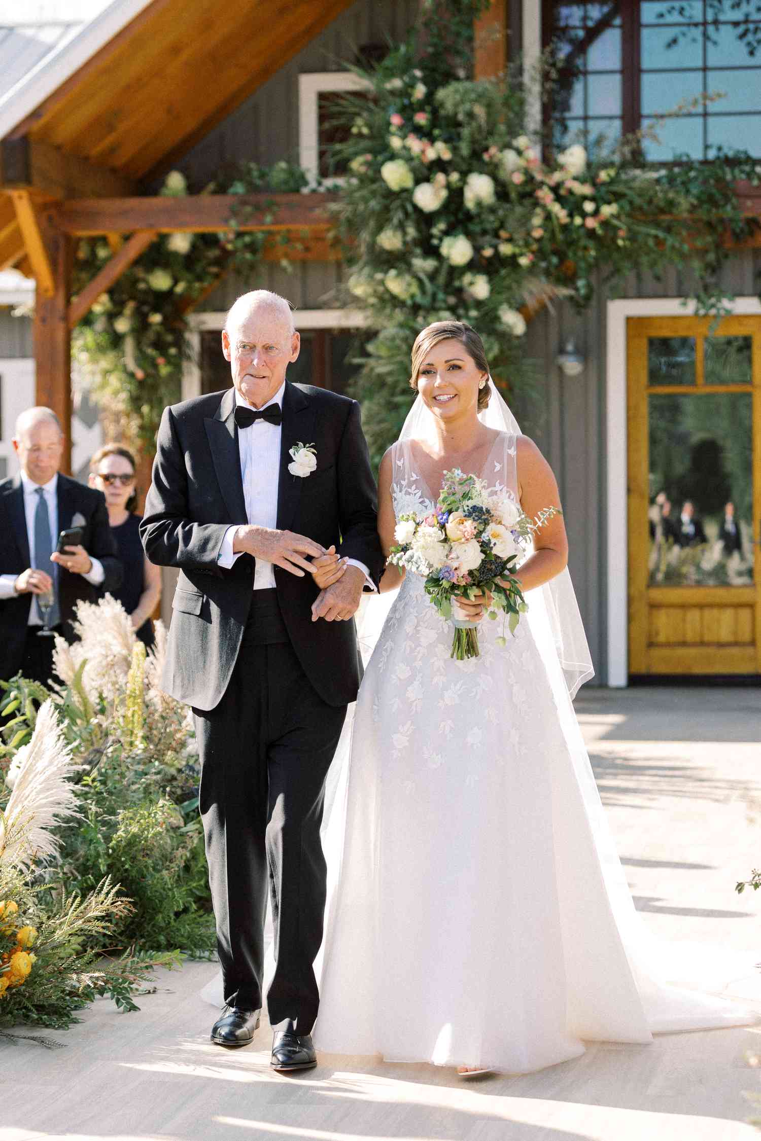 bride and her grandfather walking down the aisle