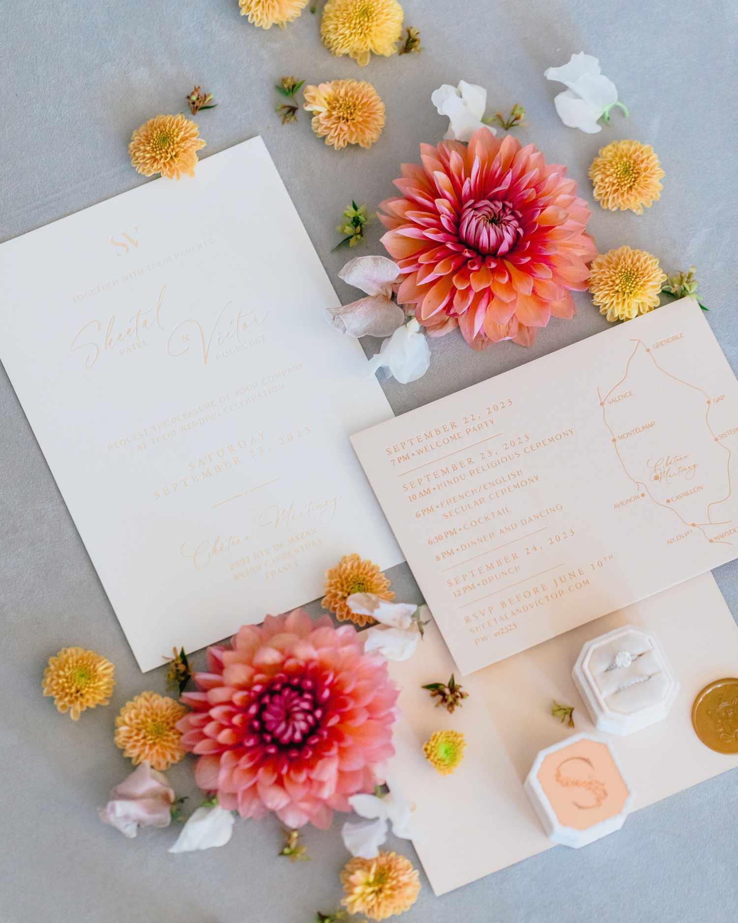 wedding invitations with flowers around it