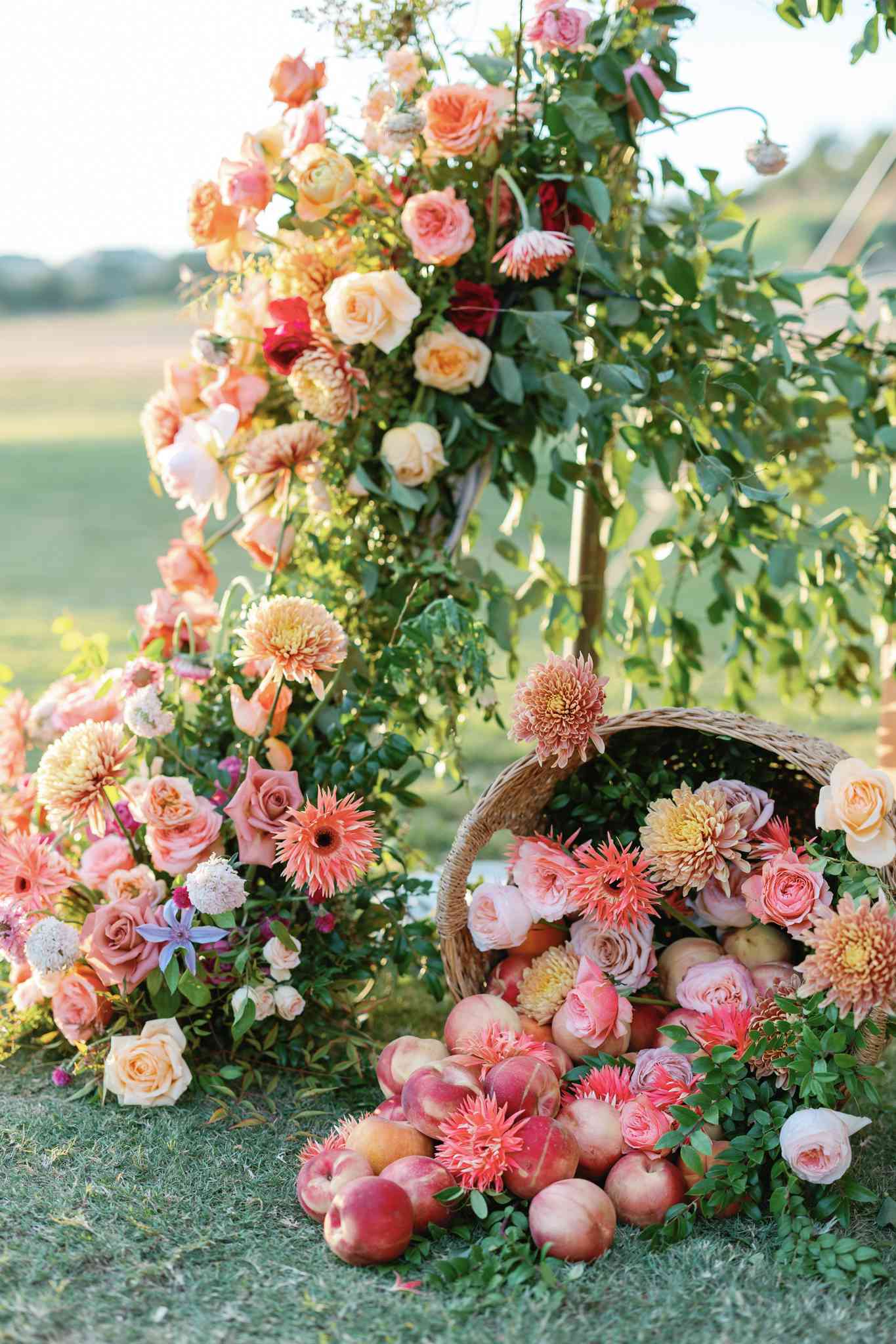 Pink Flower and Peach Decor Spilled From Basket and Wrapping Pole at Wedding Reception