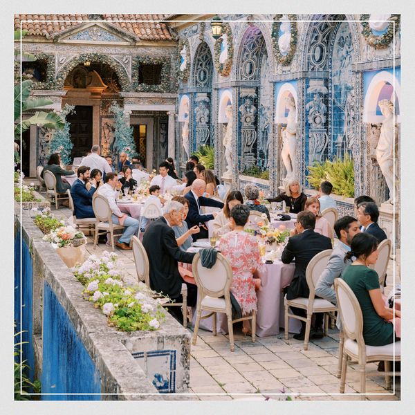 aerial shot of wedding guests at a post-ceremony reception in an Italian outdoor venue