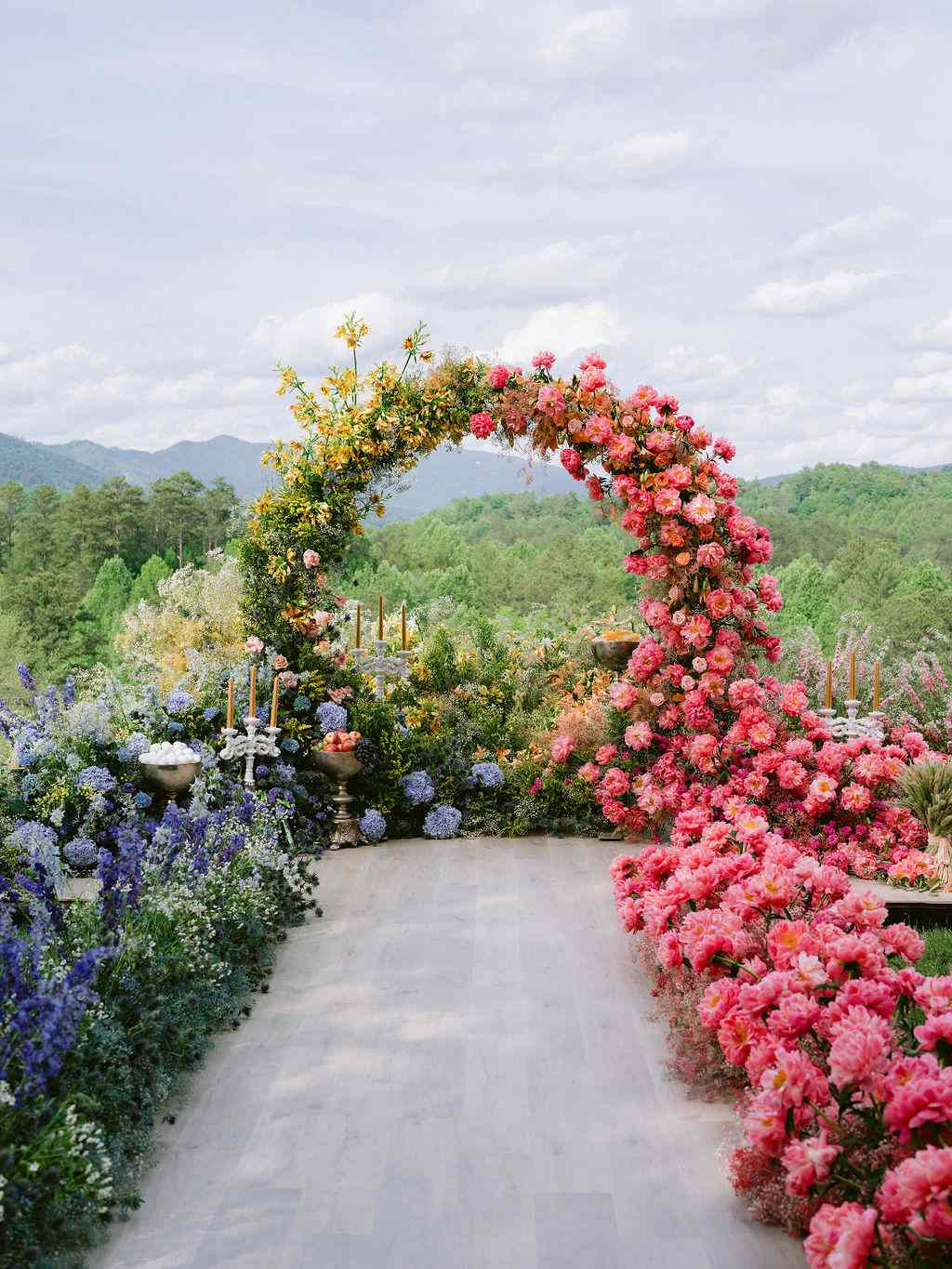 Wedding Altar with Pink, Blue, and Yellow Flower Arch