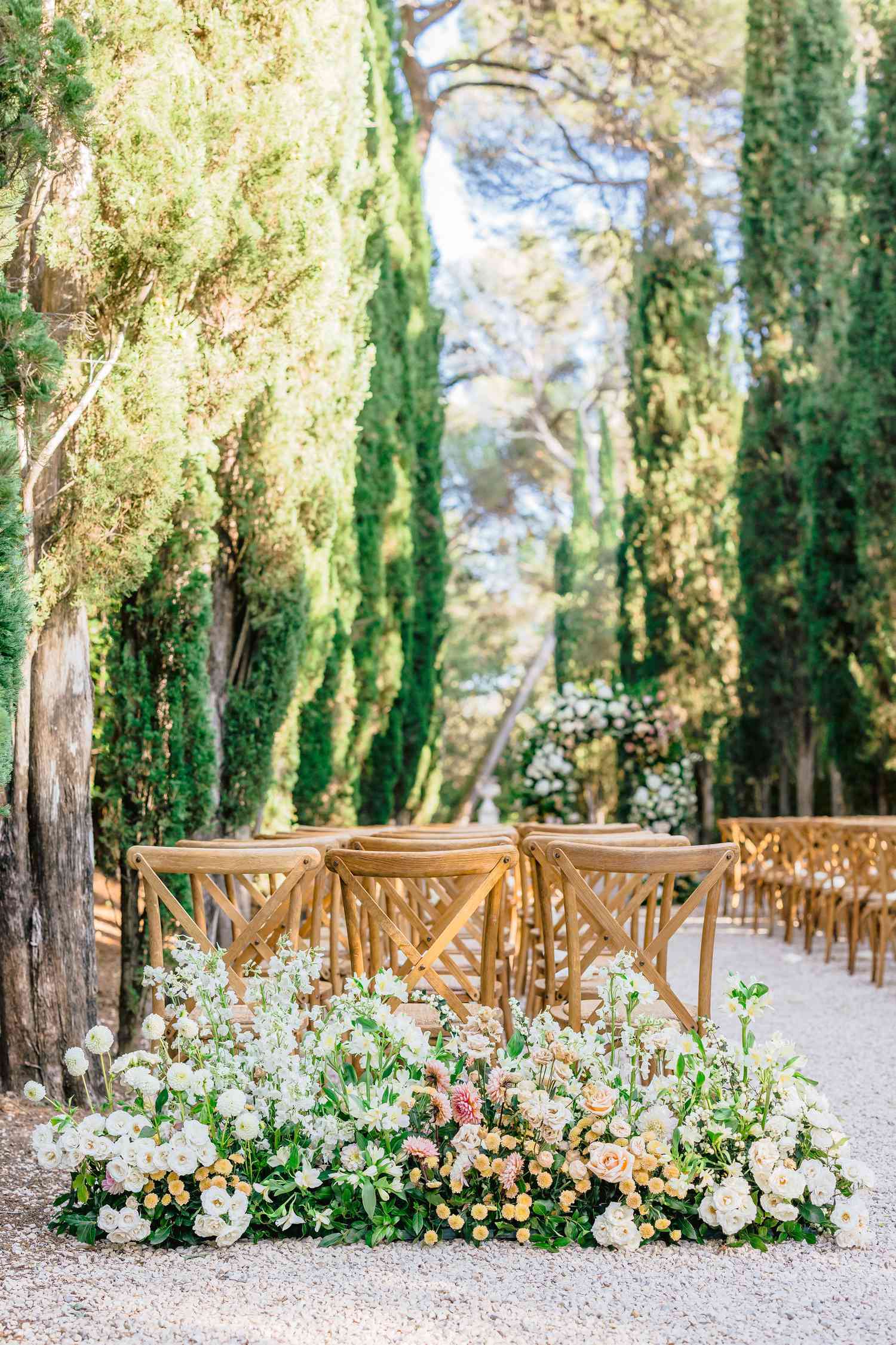 wedding ceremony chairs with flowers around