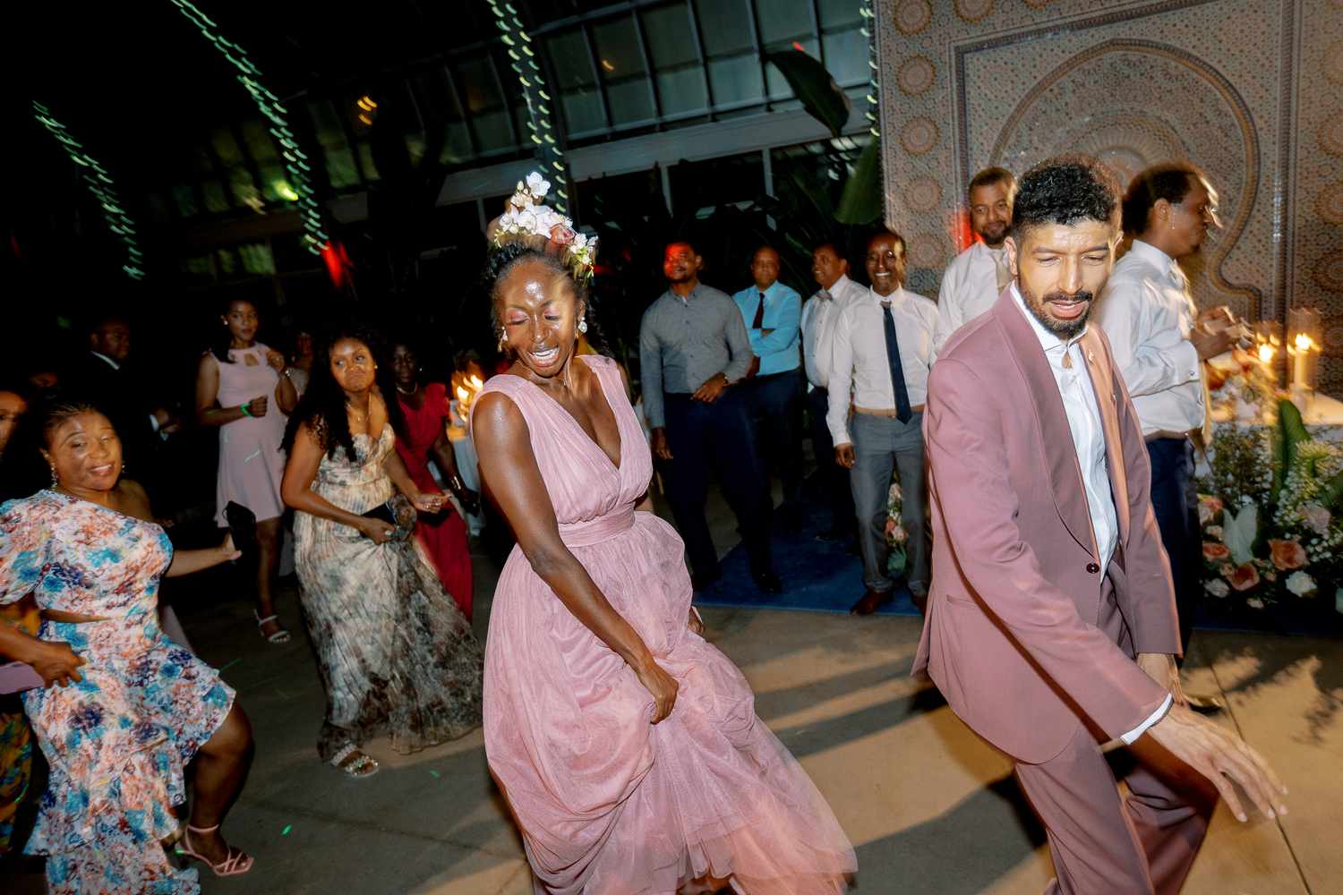 Bride in Pink Reception Gown Dancing With Groom in Pink Reception Suit