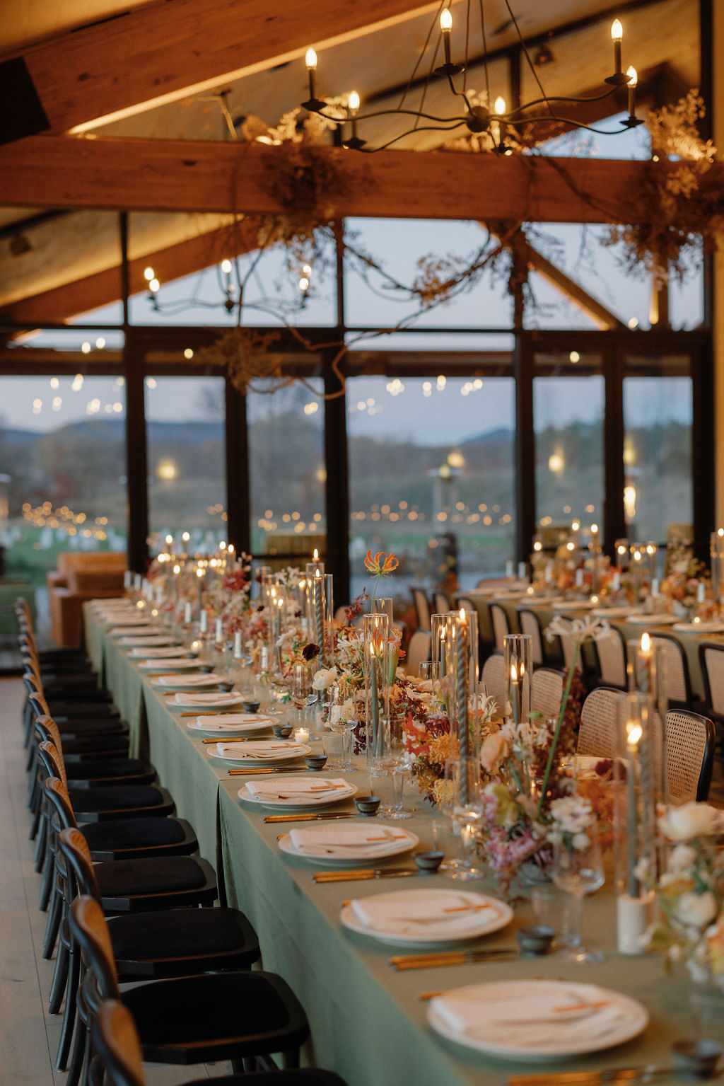 Green Reception Tables with Colorful Flower Decor in Wooden Venue