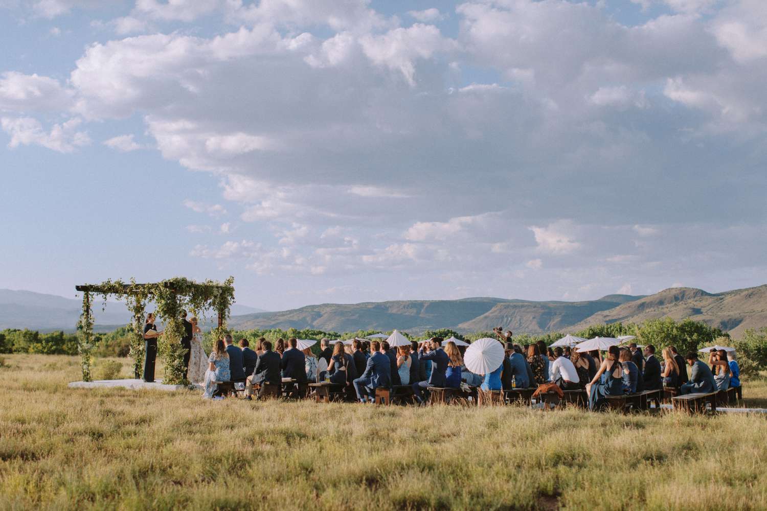 Outdoor Wedding Ceremony with Mountains in Background