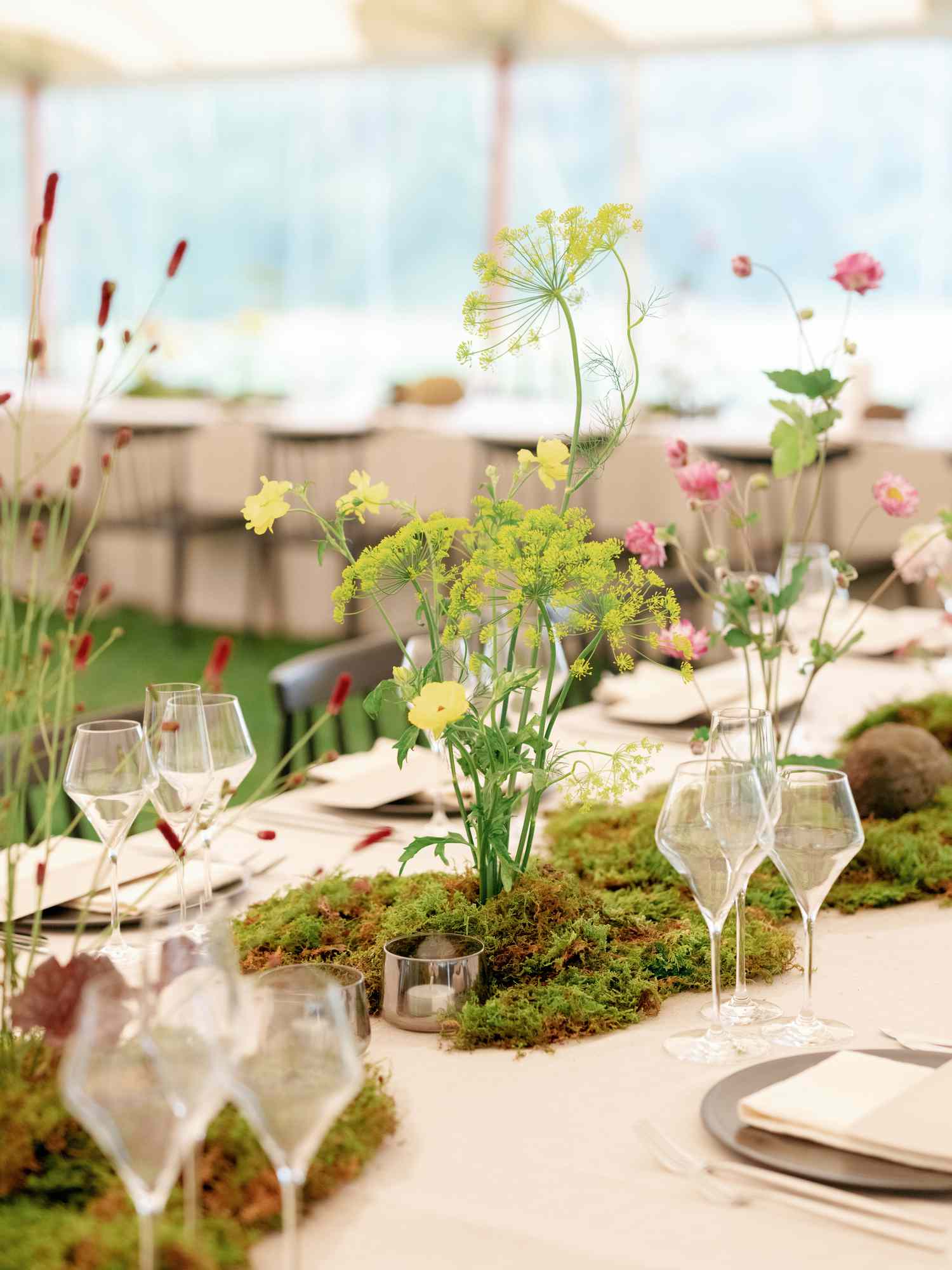 Growing Centerpiece of Moss and Wildflowers on Wedding Reception Tables