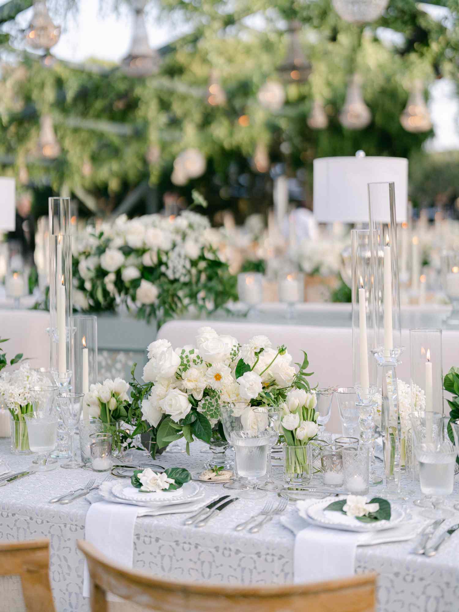 Long Wedding Reception Tables with Centerpieces of White Roses, Peonies, Anemones, and Greenery
