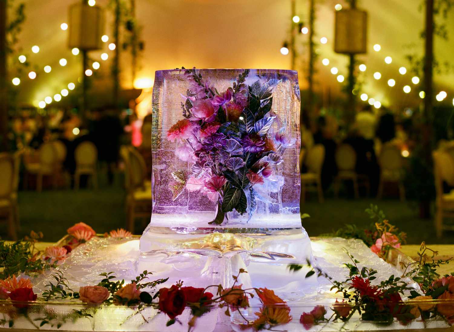 Flowers in Ice Sculpture as Center Piece at Wedding Reception