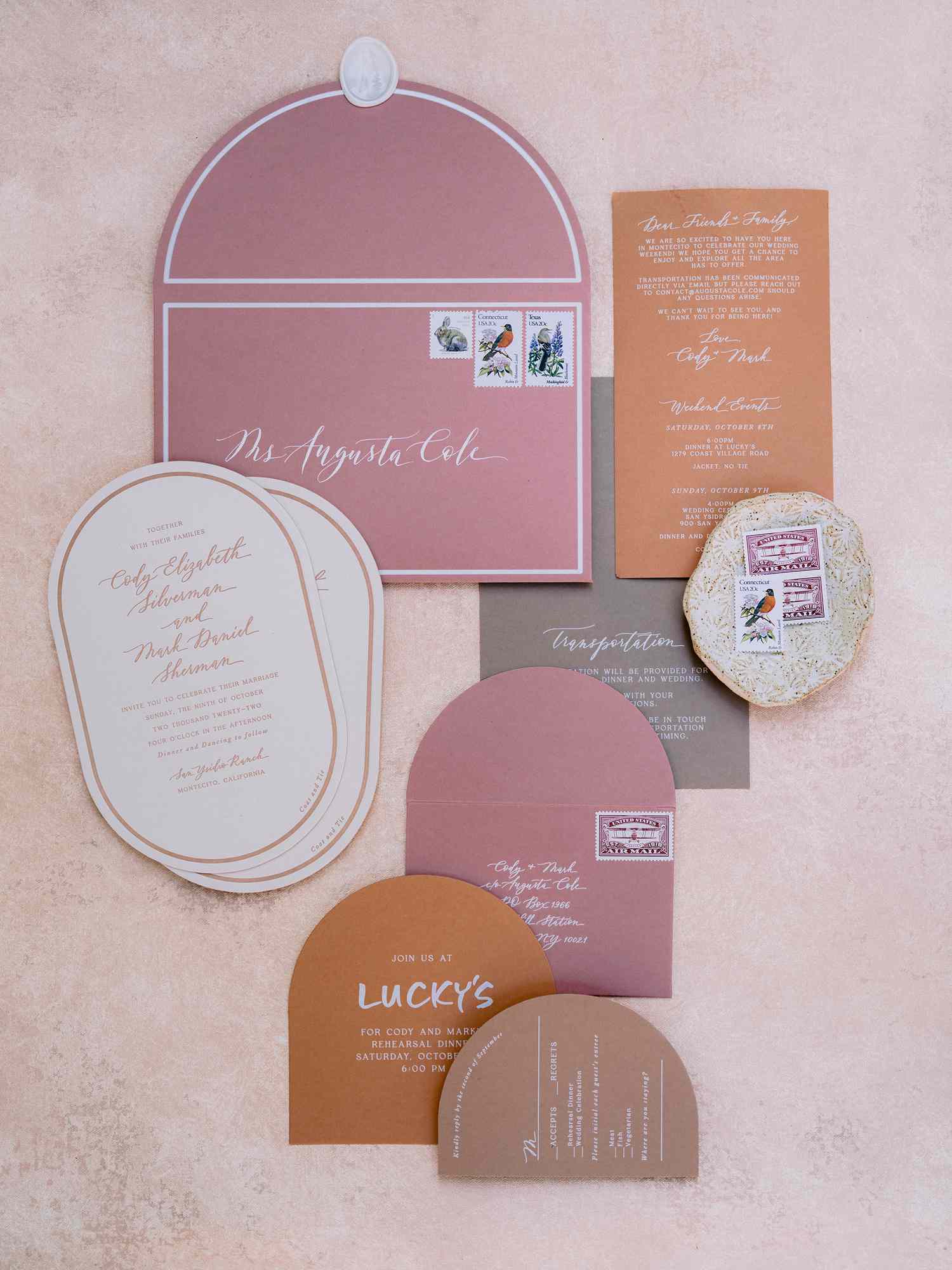 oval-shaped invitations and other stationery elements with arched edges