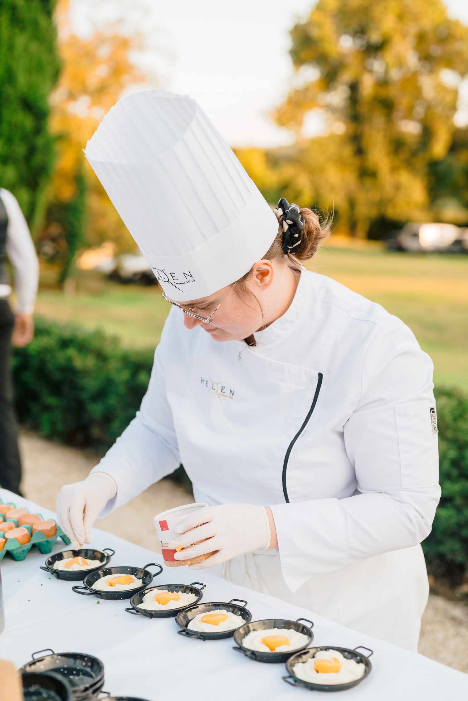 chef adding garnish to food