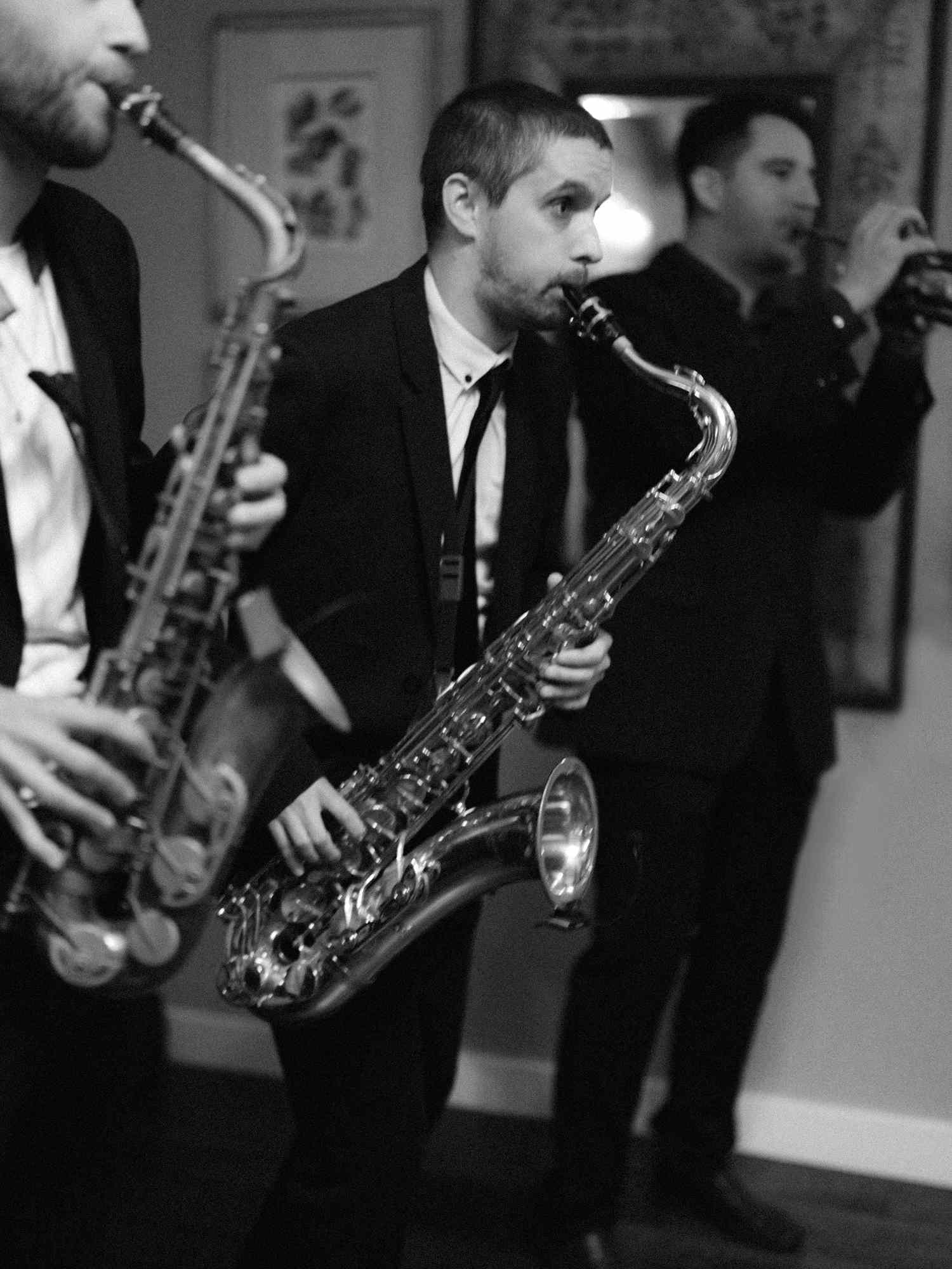 musicians playing saxophones