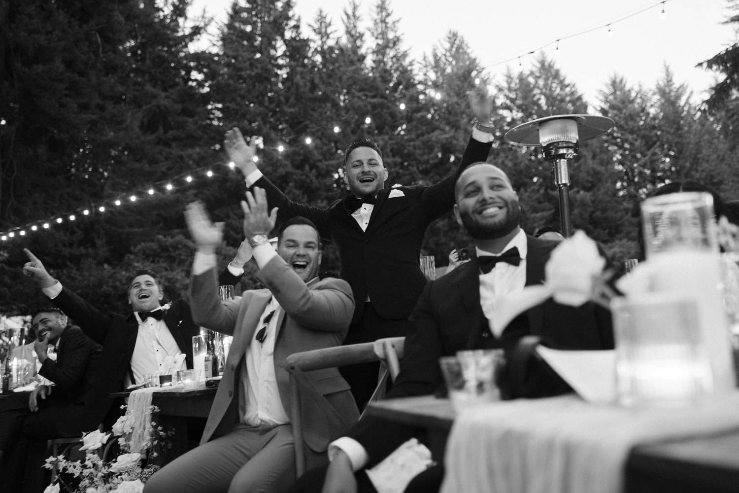 Guests Clapping While Sitting at Tables During Wedding