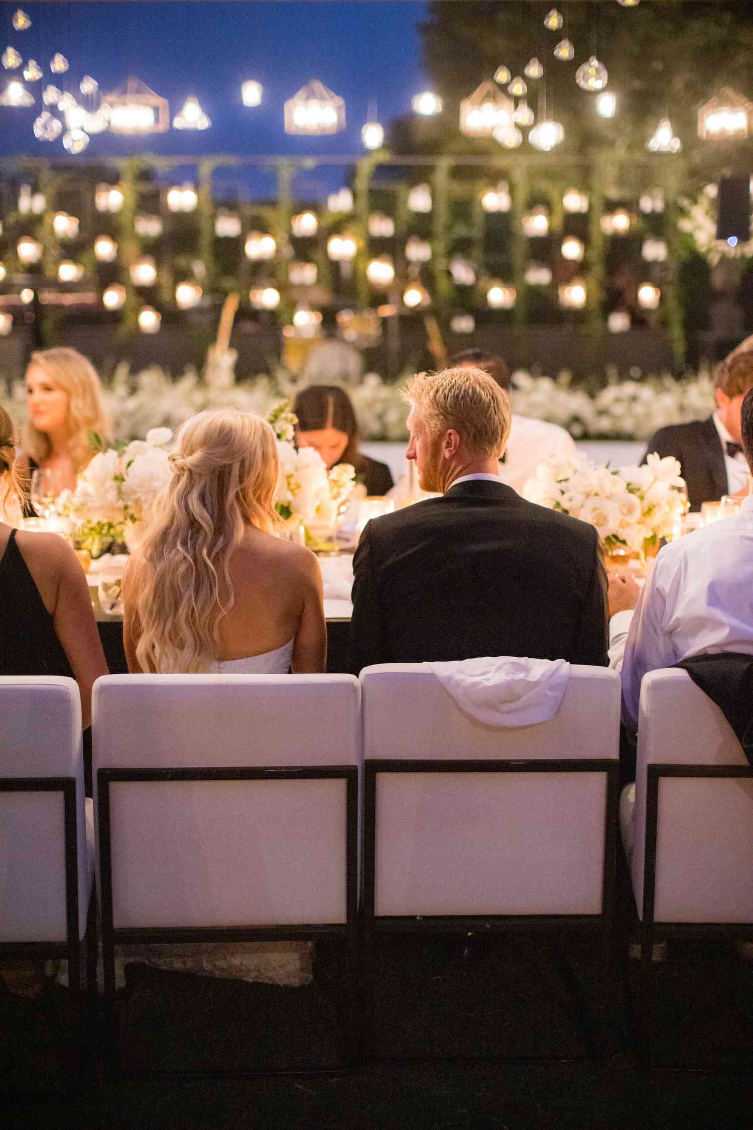 Olympic Volley Ball Player Chase Budinger and Wife Sit at Table During Wedding Reception