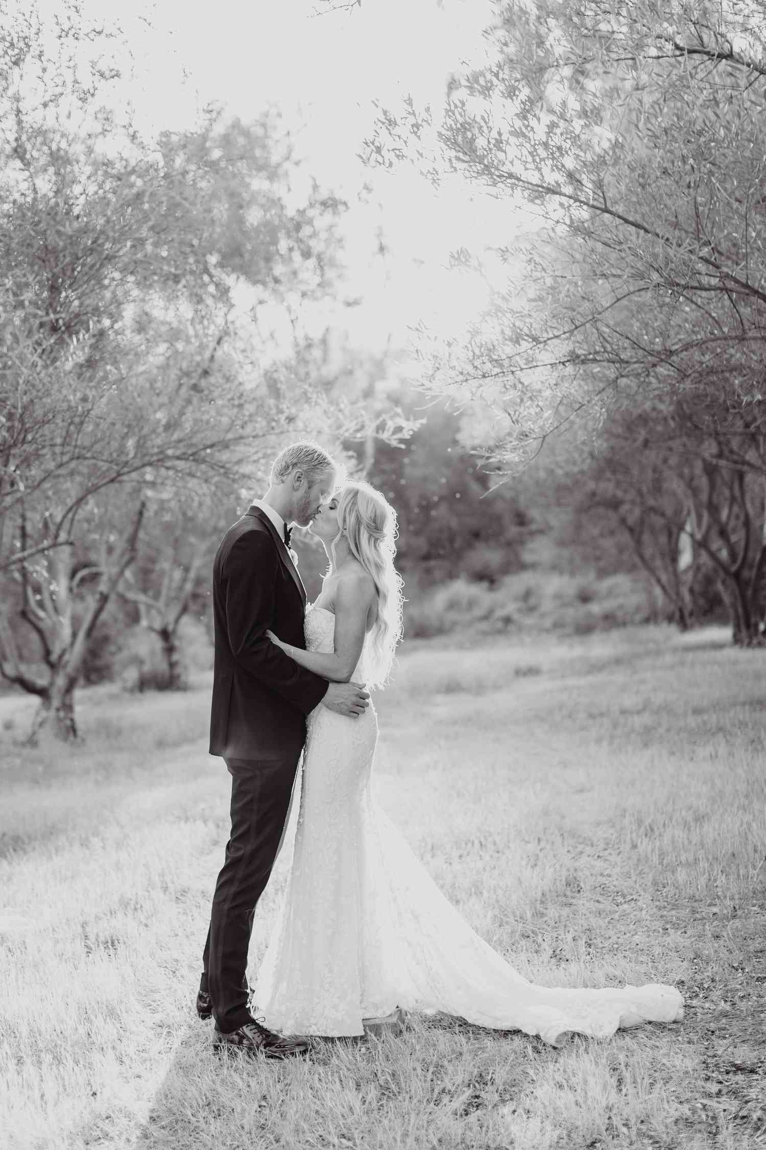 Olympic Volley Ball Player Chase Budinger and Bride Share Kiss in Field