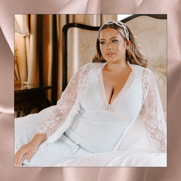 bride sitting on a bed in white pajamas