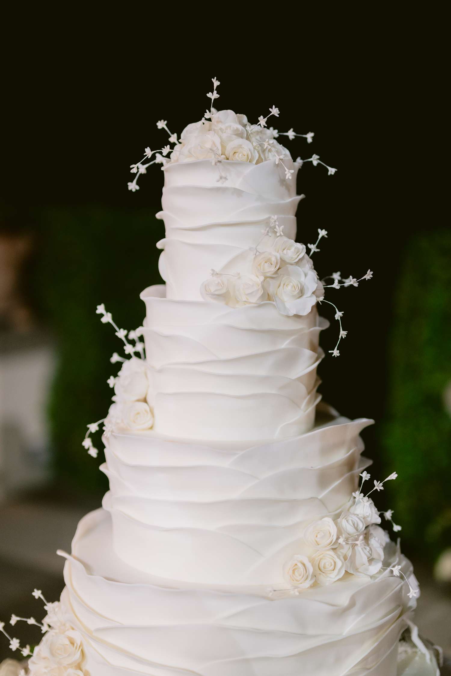 4-Tier Ruffled White Wedding Cake With Flower Detial s
