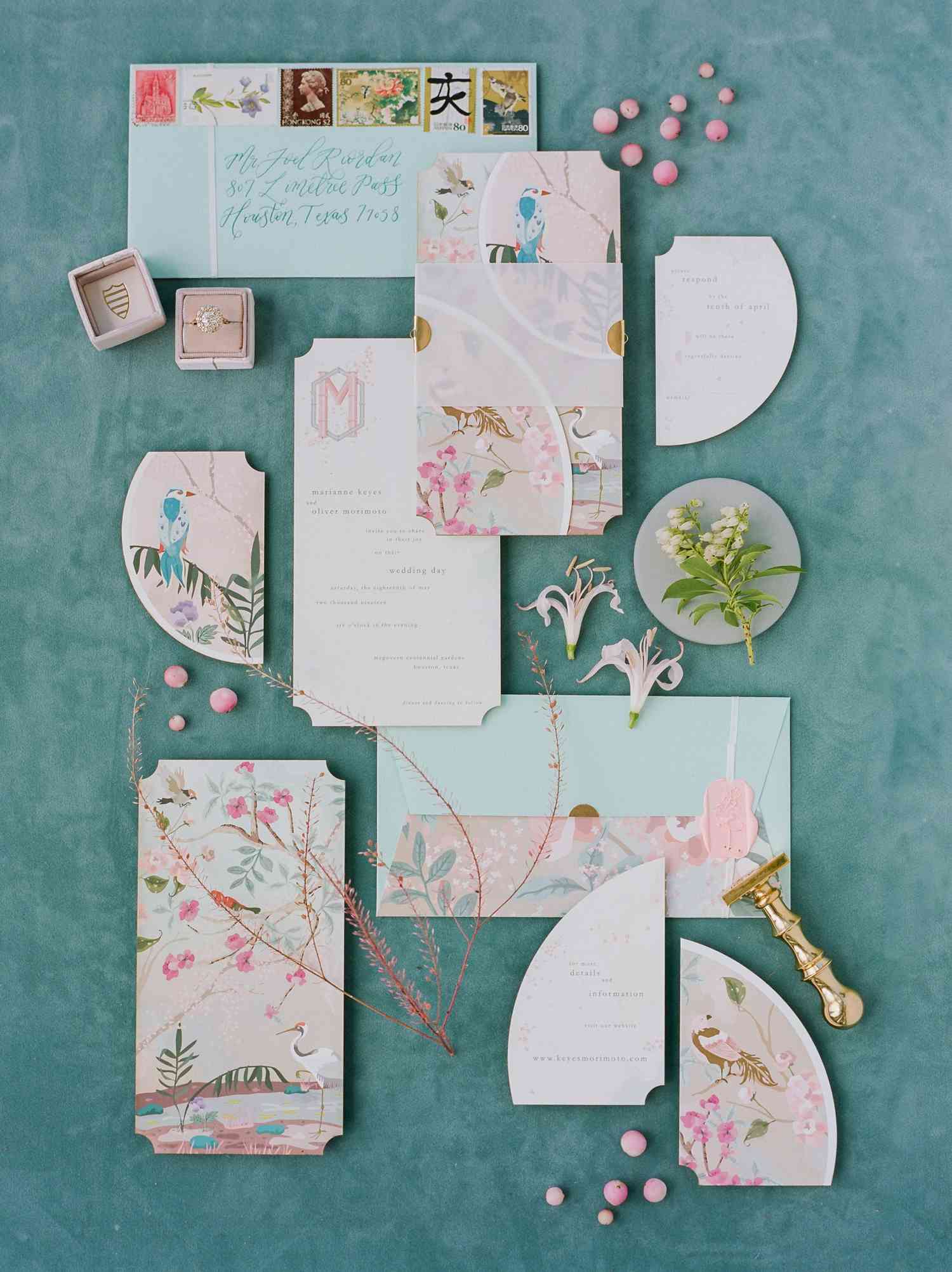 invitations with chinoiserie-inspired motif in pink and aqua colors