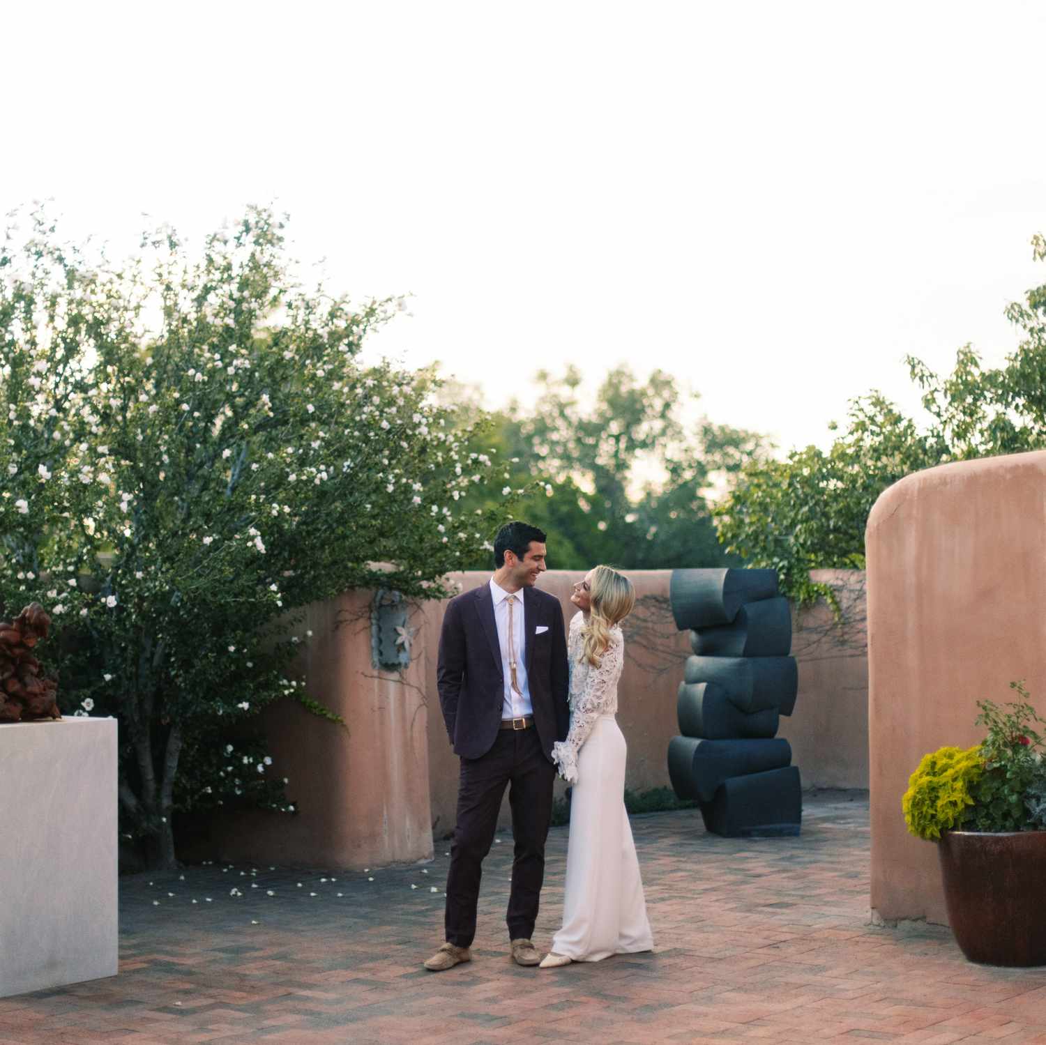 couple holding hands staring into each other's eyes