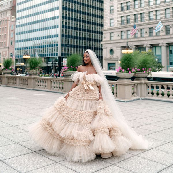 bride wearing a blush pink strapless ruffled wedding dress