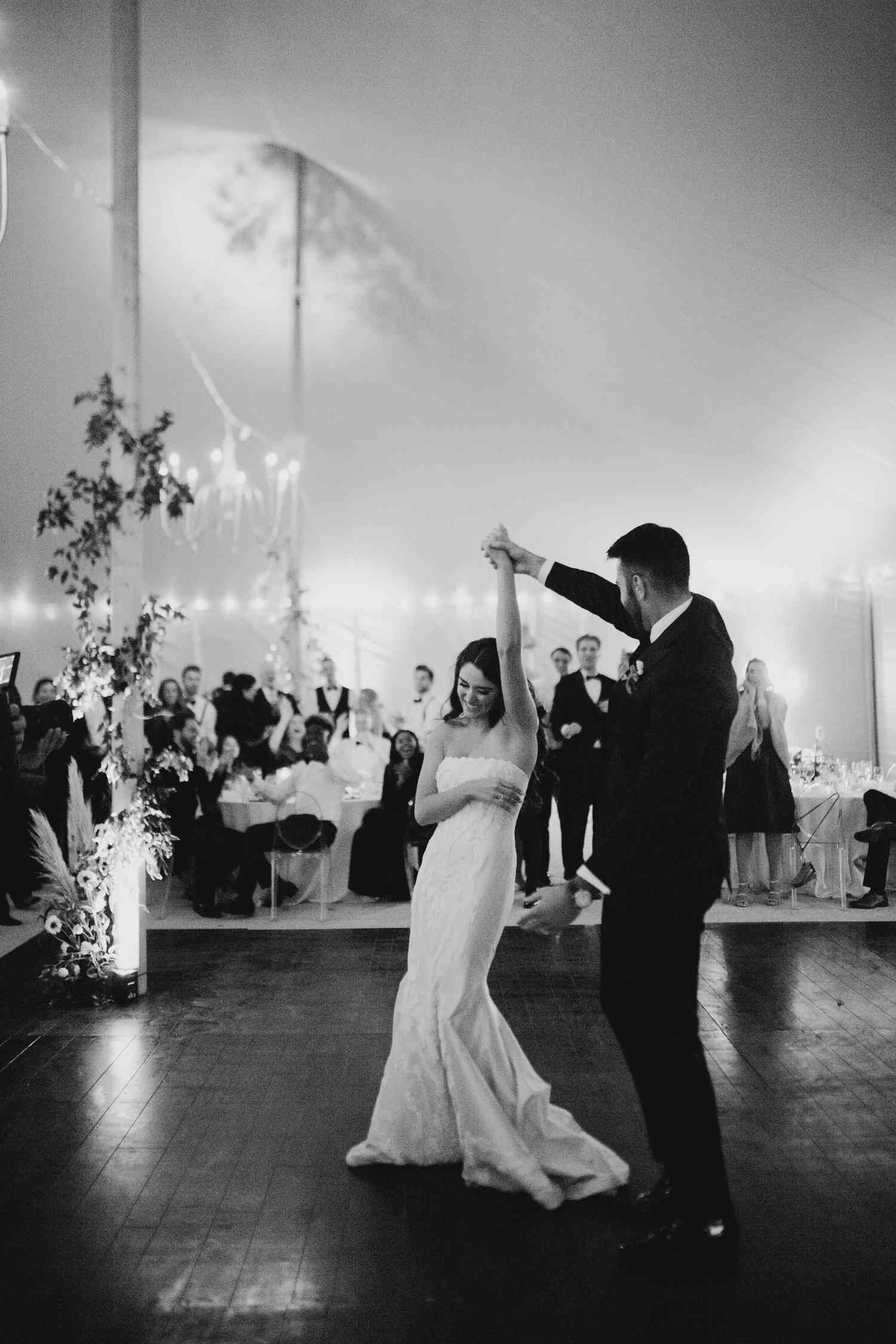 Black and white photo of an Irish bride and groom dancing on the dance floor.