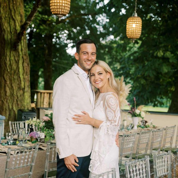 groom and bride in bohemian dress at rehearsal dinner