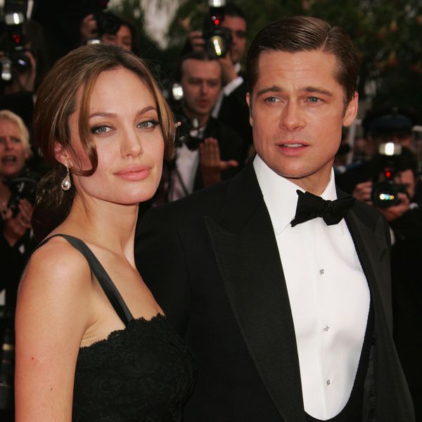 Angelina Jolie in Black Dress and Brad Pitt in Tuxedo on Red Carpet