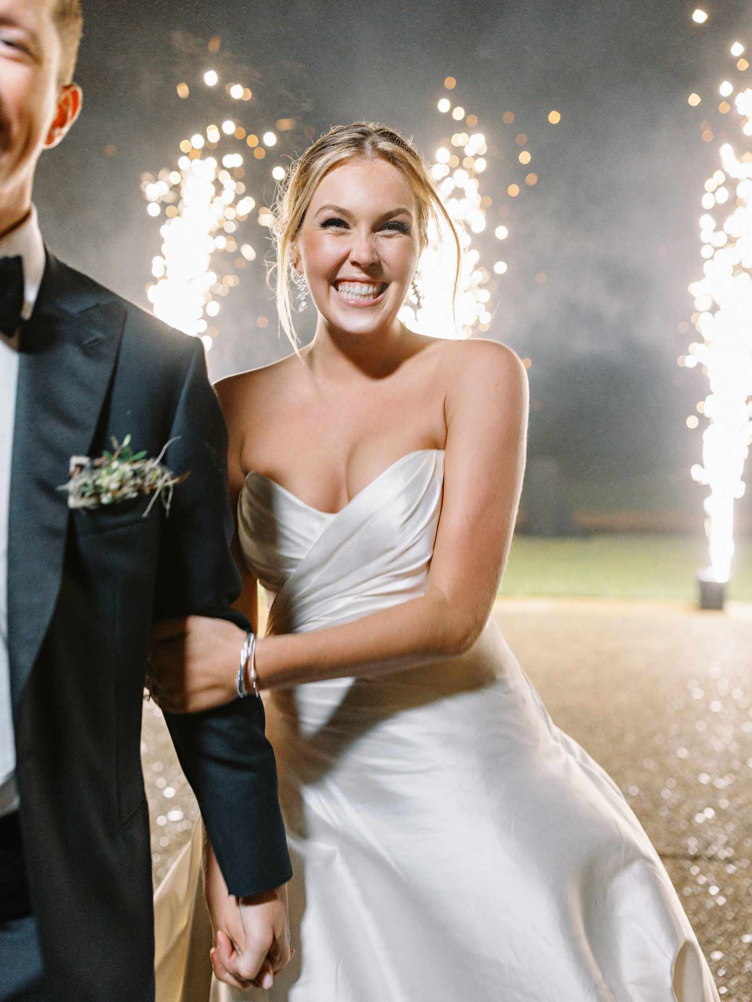 Bride and Groom Make Their Wedding Entrance Surrounded by Sparklers