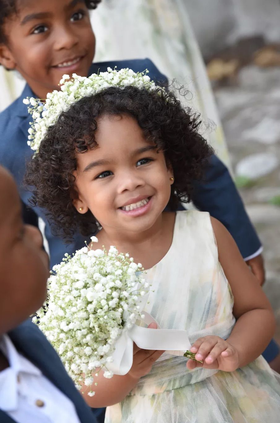 Flower girl with baby's breath crown and bouquet
