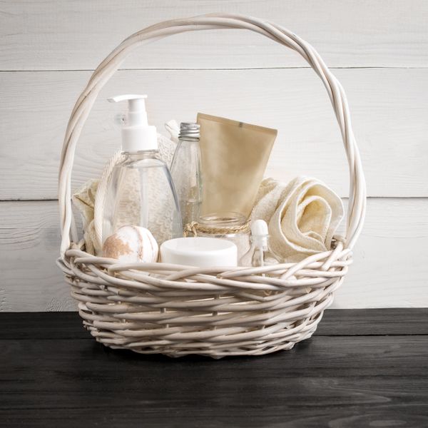 A white basket with toiletries and restroom necessities at a wedding.