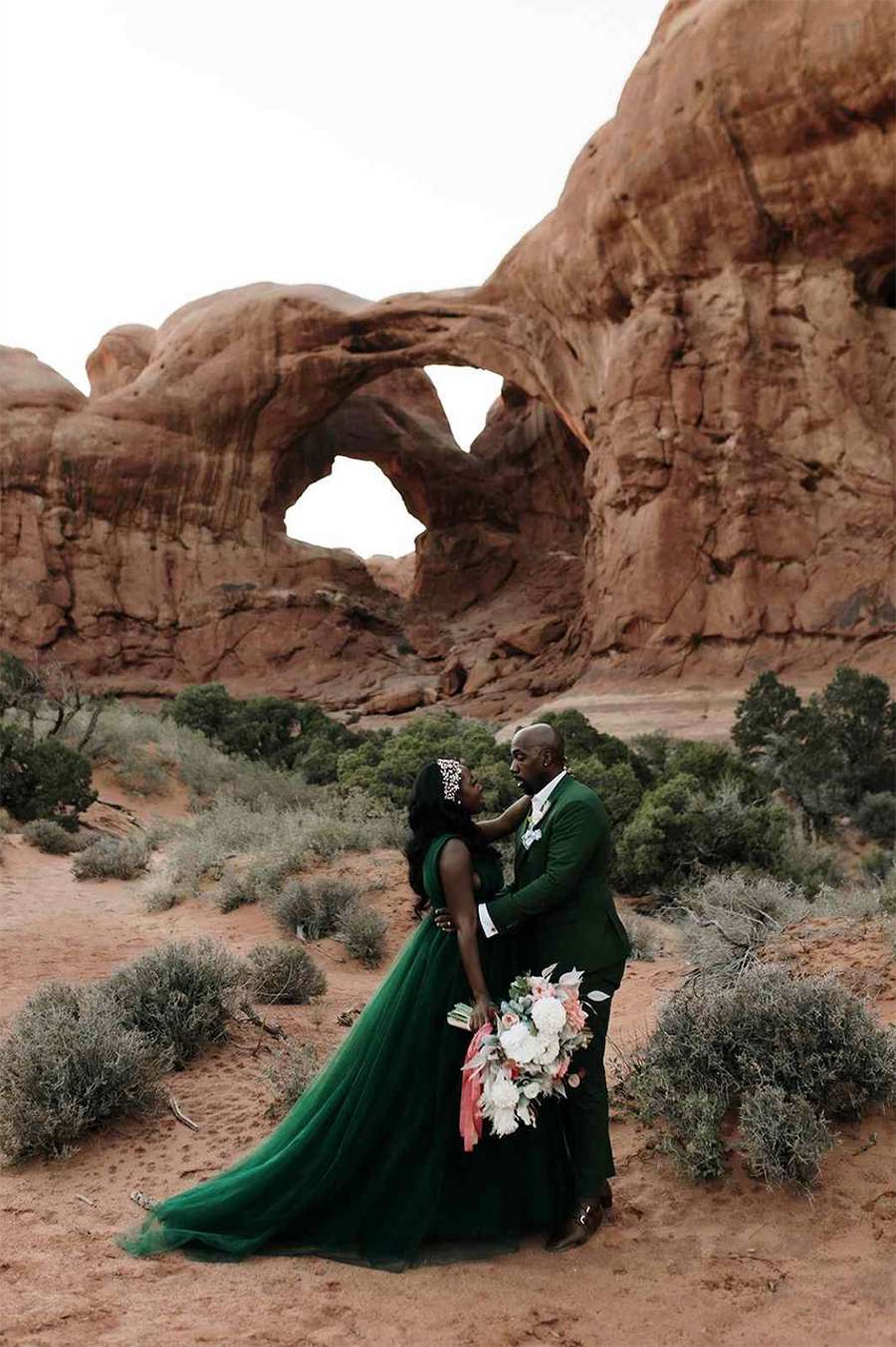 Couple Wearing Green Poses During Their Wedding Elopement Photo Shoot in Utah