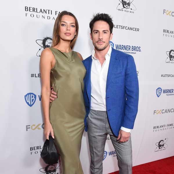 Bregje Heinen and Michael Trevino with their arms around one another on the red carpet