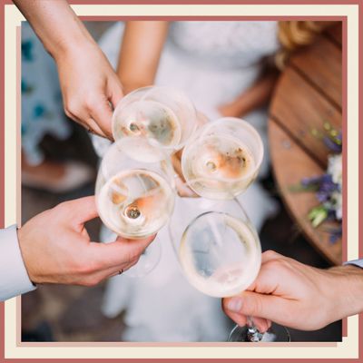 Closeup of Wedding Guests Holding Wine Glasses
