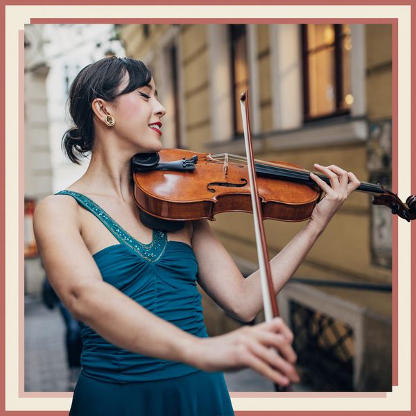 Woman in Blue Dress Playing Violin